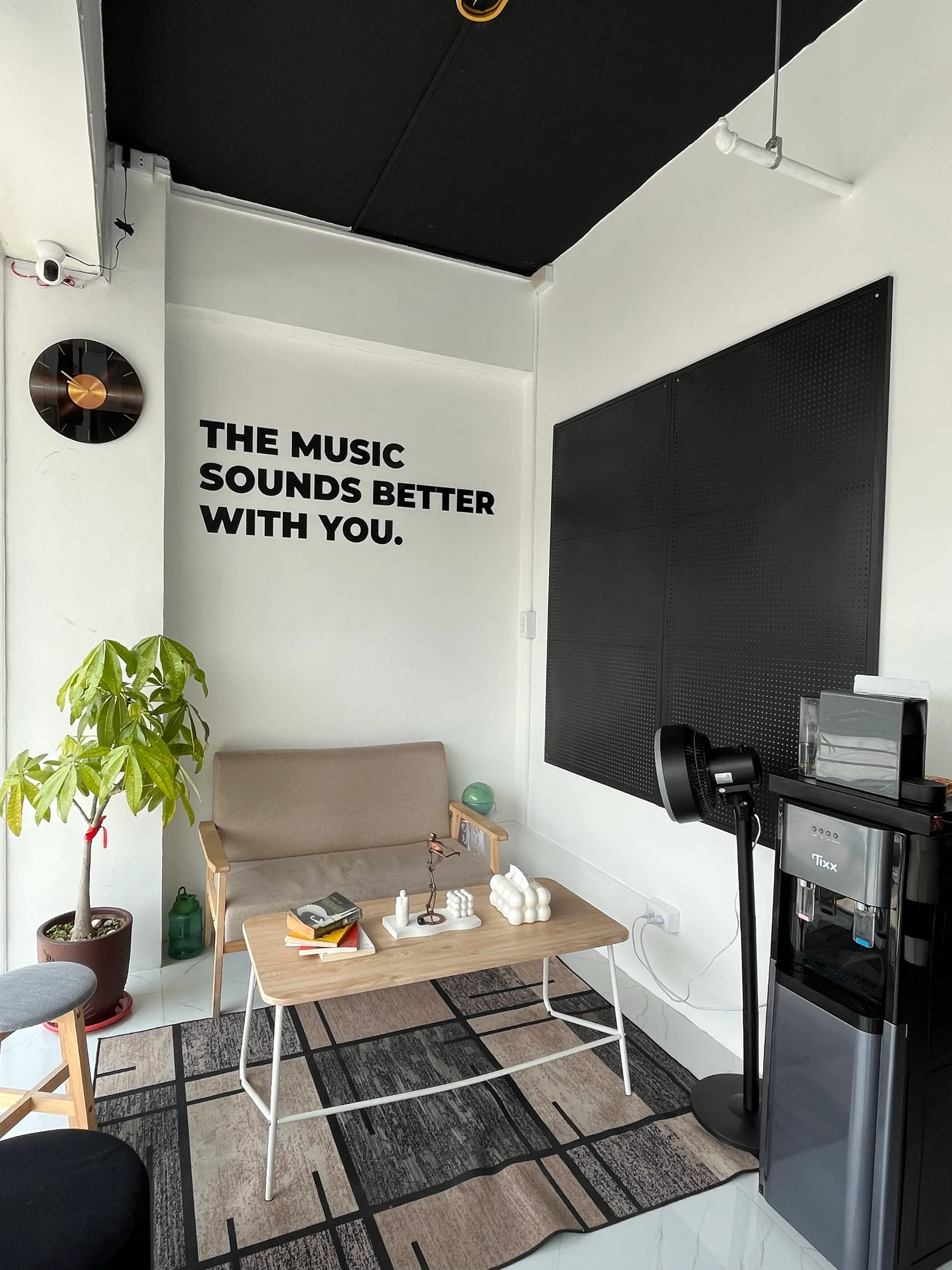 The academy lobby, with the line The music sounds better with you on the wall